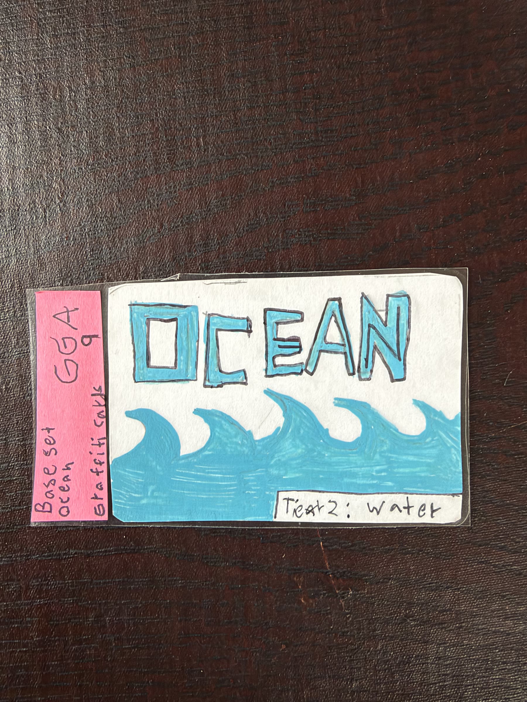 Graded Ocean graffiti card in blue marker
