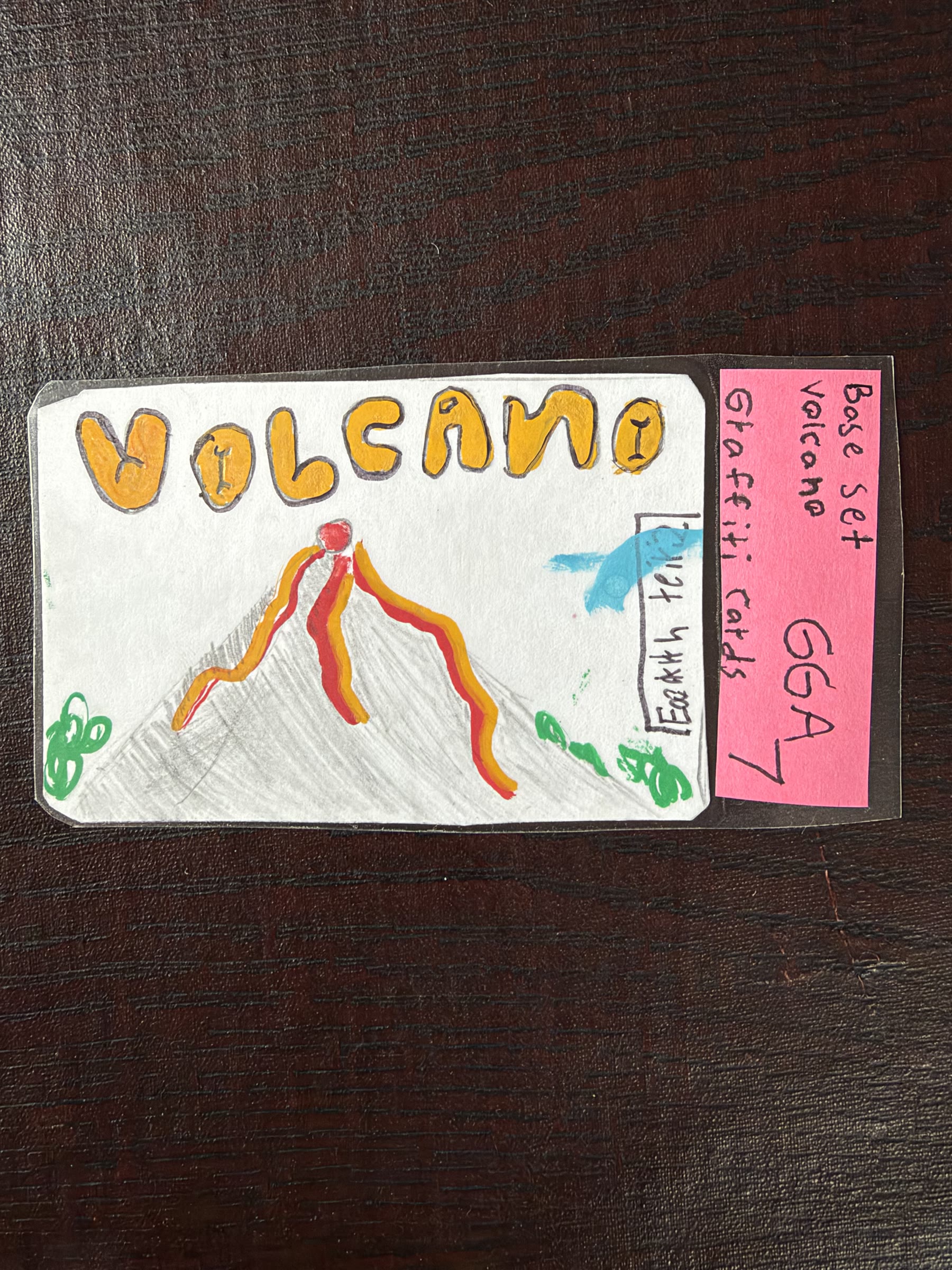 Graded Volcano graffiti card in orange and red marker